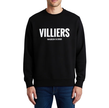 Herren Premium Sweatshirt von VILLIERS MAISON SUISSE in Schwarz mit weissem Logo auf der Brust, getragen von einem Model in Frontansicht.