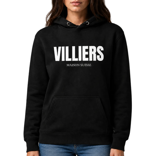 Premium Damen Hoodie von VILLIERS MAISON SUISSE in Schwarz mit weißem Logo auf der Brust, getragen von einem Model in der Frontansicht.